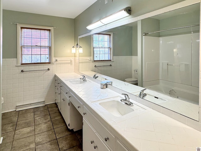 full bath featuring toilet, visible vents, and a sink