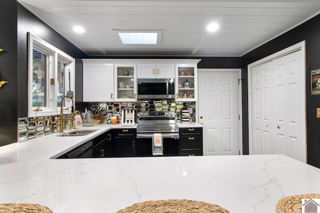 273 Bayshore Dr, Cadiz, KY 42211 - kitchen featuring stainless steel appliances, glass insert cabinets, tasteful backsplash, light stone countertops, and white cabinetry