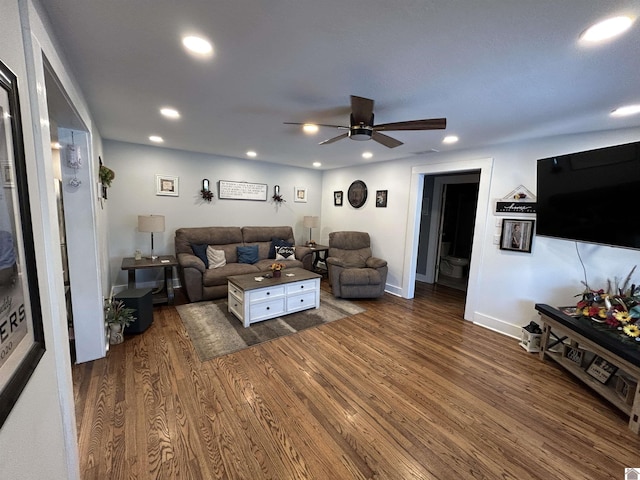 living area with dark wood-style floors, ceiling fan, baseboards, and recessed lighting