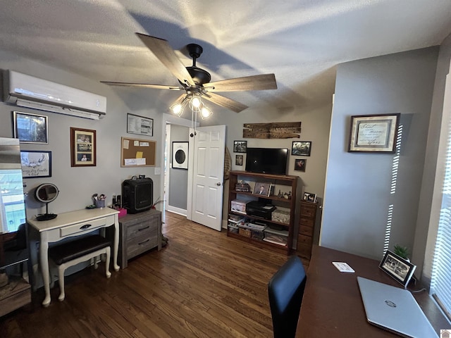 home office featuring a textured ceiling, an AC wall unit, dark wood finished floors, and a ceiling fan