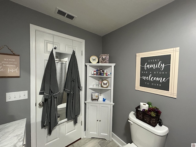 mudroom with visible vents and light wood-style flooring