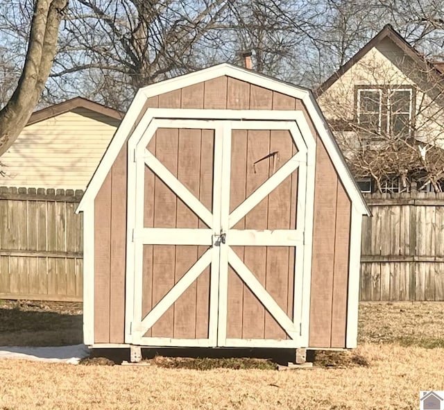 view of shed with fence