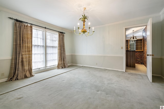 carpeted empty room featuring baseboards, a chandelier, and crown molding