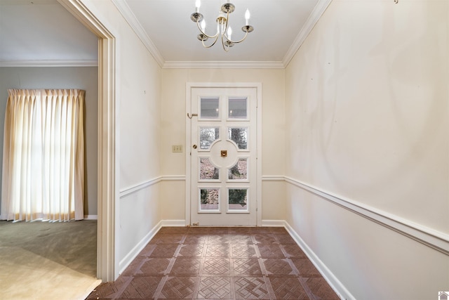 doorway featuring baseboards, ornamental molding, and a notable chandelier