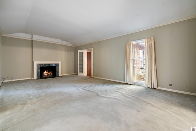 unfurnished living room with carpet floors, ornamental molding, and lofted ceiling