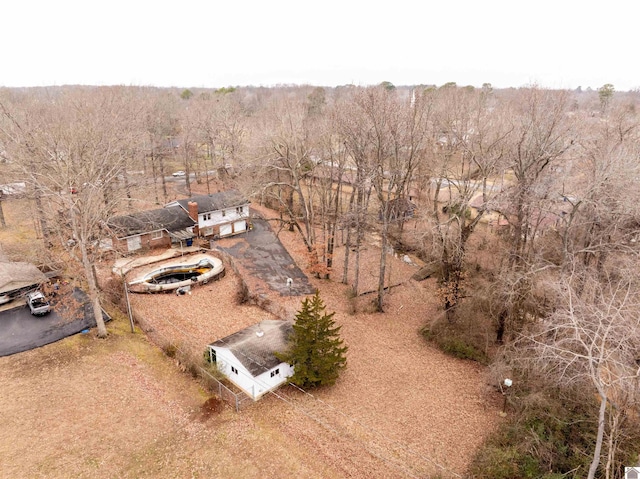 birds eye view of property with a forest view