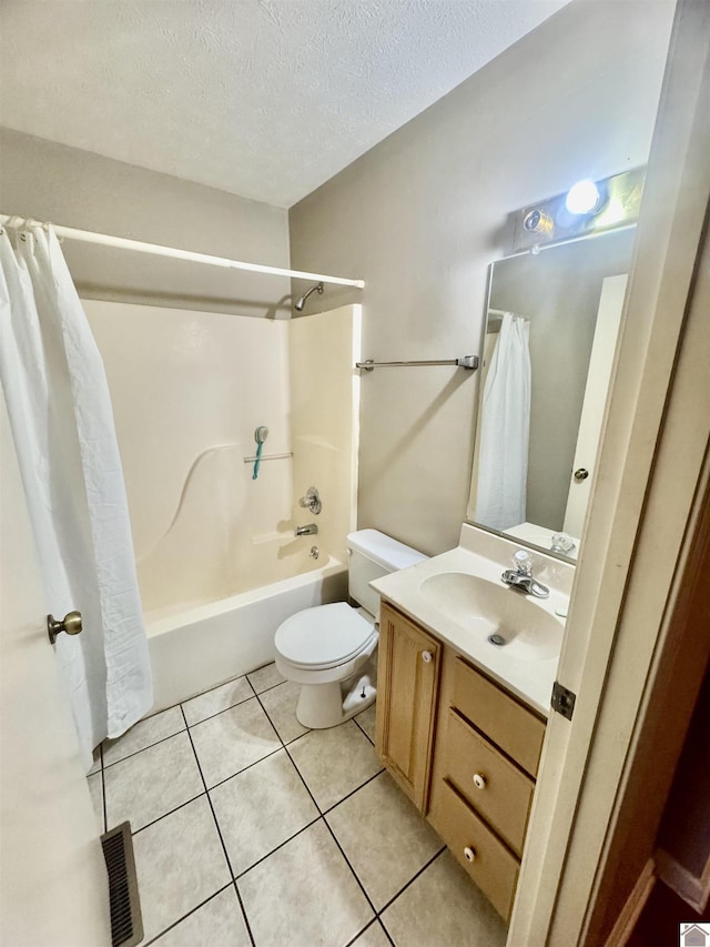 bathroom with a textured ceiling, vanity, visible vents, tile patterned floors, and shower / bathtub combination with curtain