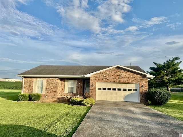 41 Rhett Blvd, Cadiz, KY 42211 - ranch-style house with brick siding, concrete driveway, a garage, and a front yard