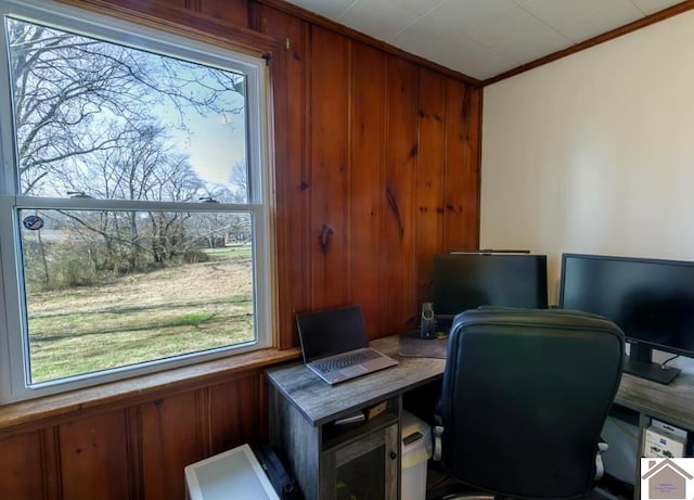 office featuring wood walls and crown molding