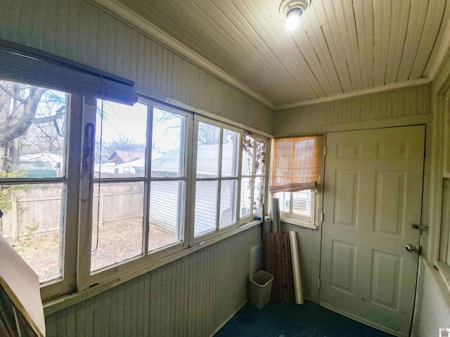 sunroom featuring a wealth of natural light and wooden ceiling