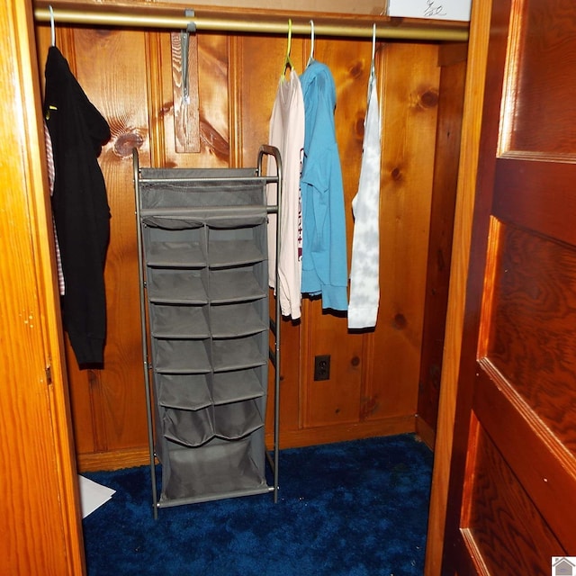 interior space featuring dark colored carpet and radiator heating unit