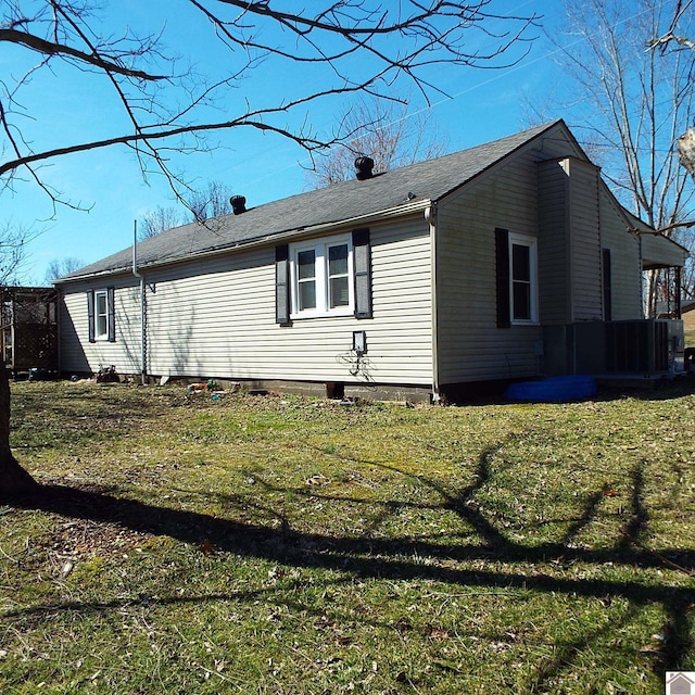 view of side of home featuring a yard