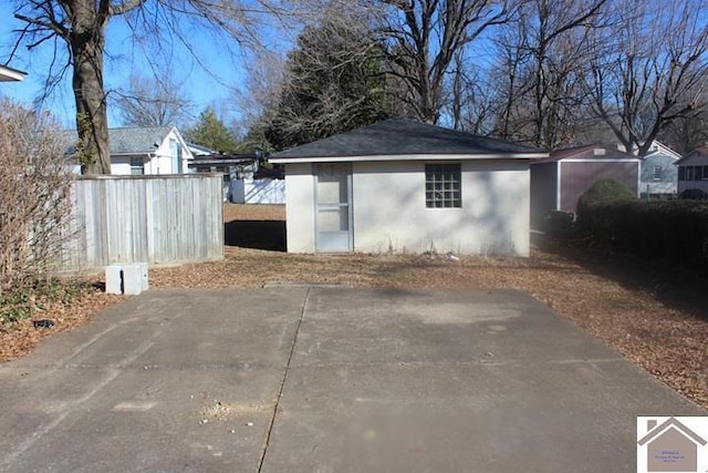 view of outdoor structure featuring fence