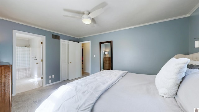 bedroom featuring crown molding, visible vents, ensuite bathroom, light carpet, and ceiling fan