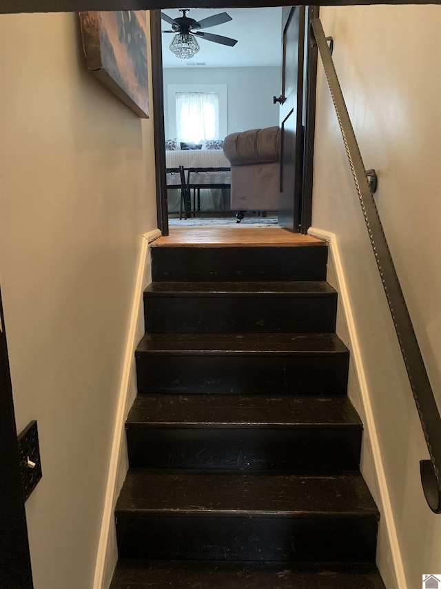 stairs with ceiling fan