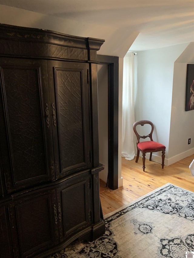 interior space featuring light wood finished floors and baseboards