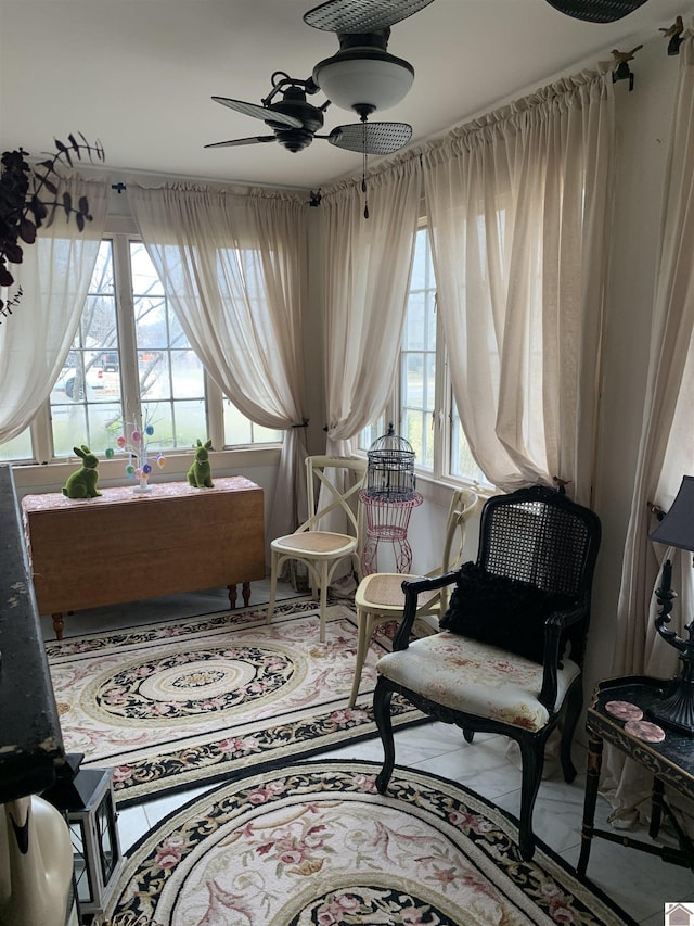 living area featuring ceiling fan