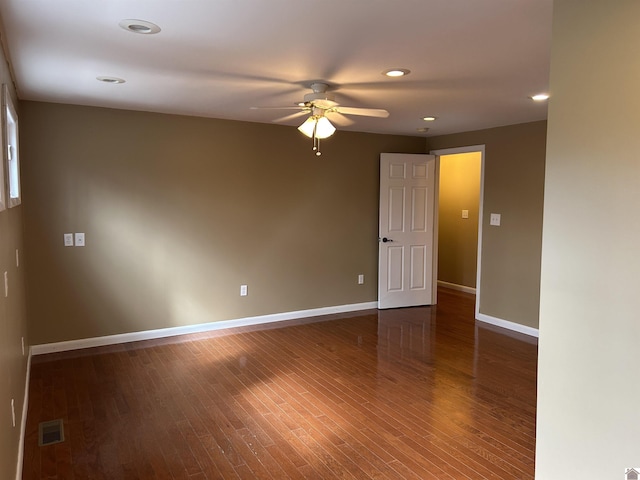 empty room with visible vents, baseboards, a ceiling fan, wood finished floors, and recessed lighting