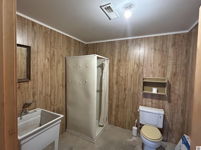 full bathroom with toilet, wood walls, a sink, visible vents, and a shower stall