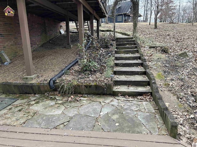 view of yard with a patio and stairs