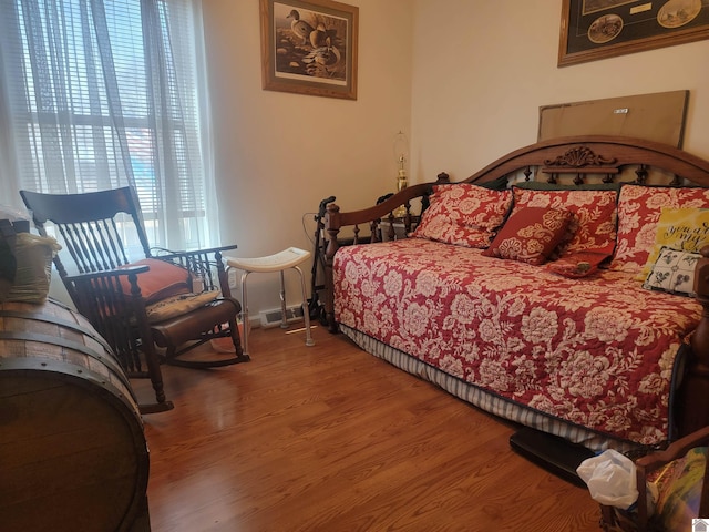 bedroom featuring wood finished floors