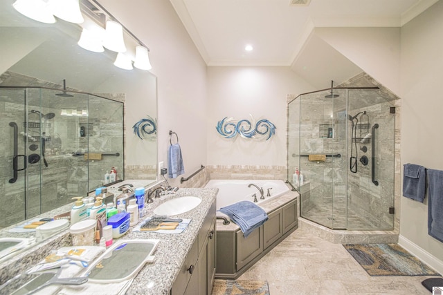 bathroom with double vanity, a stall shower, ornamental molding, a sink, and a bath