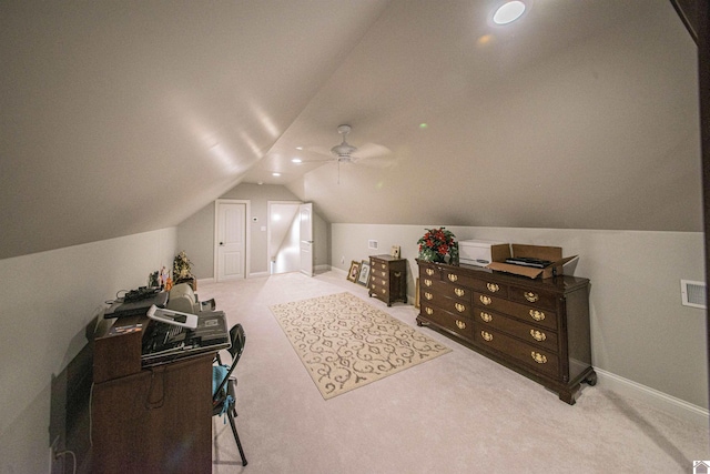 interior space featuring carpet floors, ceiling fan, baseboards, and vaulted ceiling