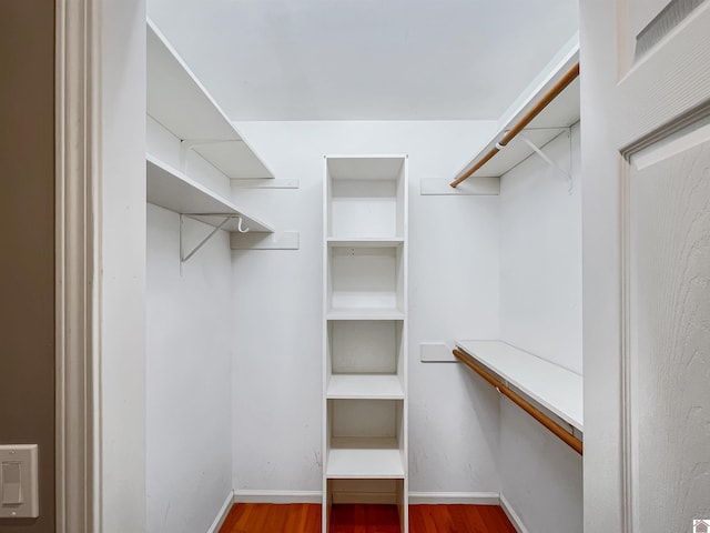 spacious closet with wood finished floors