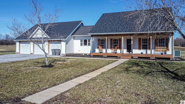 view of front facade with central air condition unit, covered porch, a shingled roof, and a front lawn