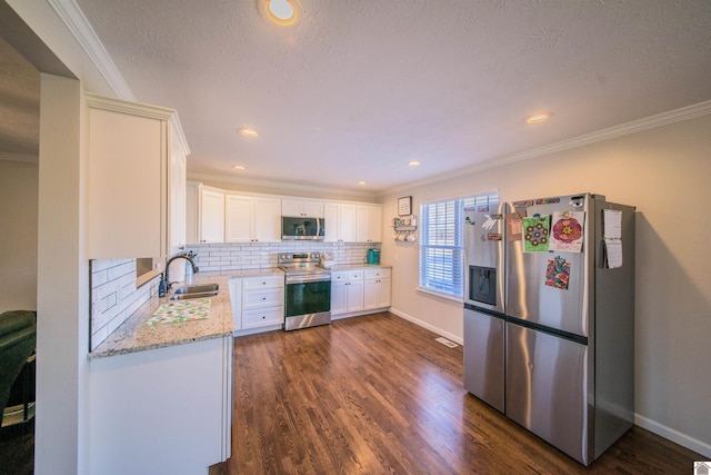 kitchen featuring appliances with stainless steel finishes, dark wood-style flooring, crown molding, and tasteful backsplash