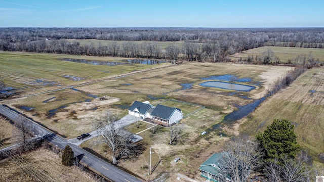 birds eye view of property with a rural view and a water view