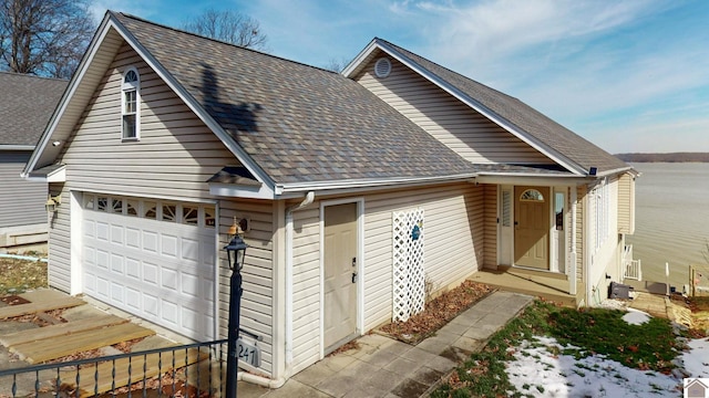 view of front of house with roof with shingles