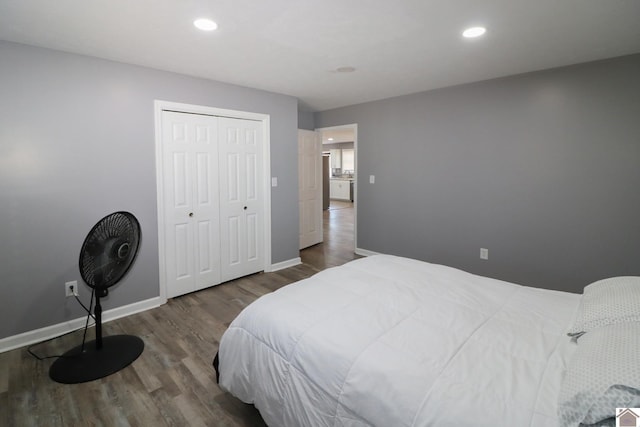 bedroom featuring recessed lighting, a closet, baseboards, and wood finished floors