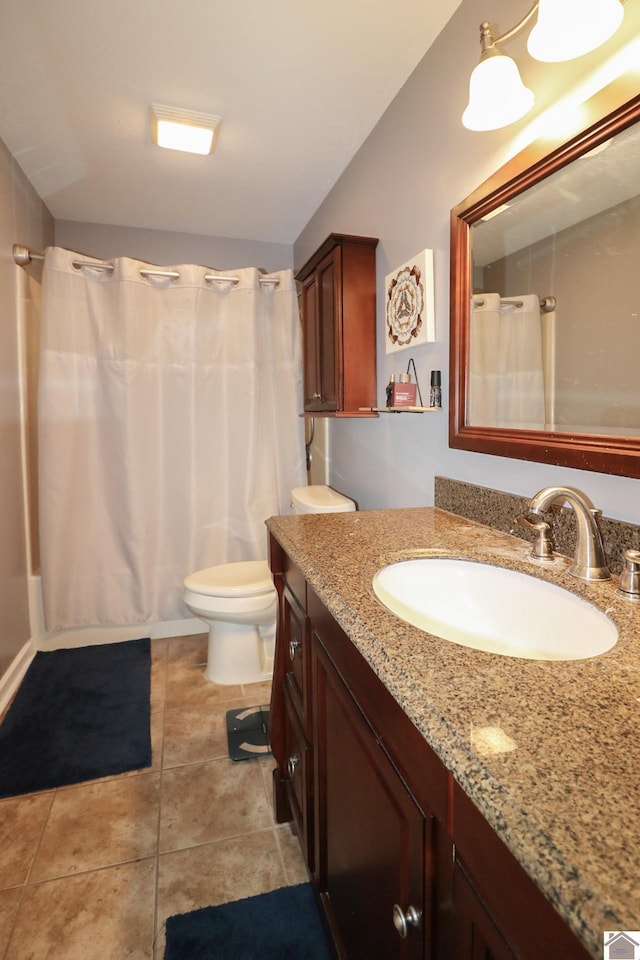 bathroom with toilet, tile patterned flooring, a shower with shower curtain, and vanity