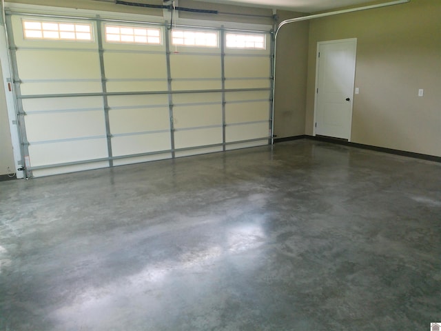 24 Hill Creek Ln, Benton, KY 42003 - garage featuring baseboards