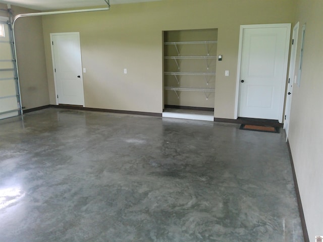 24 Hill Creek Ln, Benton, KY 42003 - garage featuring baseboards