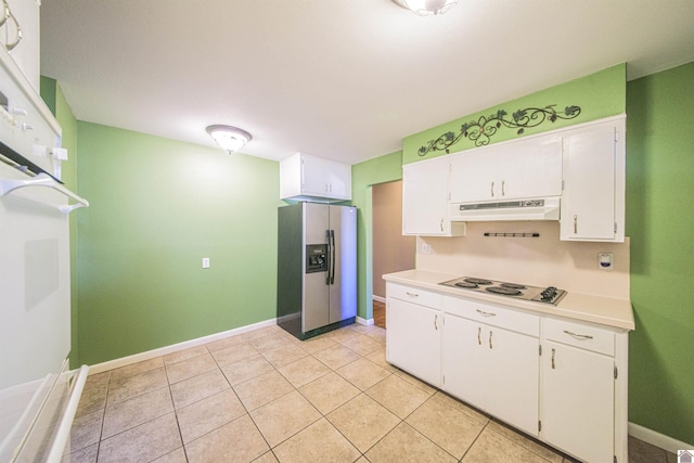 kitchen with stainless steel refrigerator with ice dispenser, black electric stovetop, light countertops, white cabinetry, and under cabinet range hood