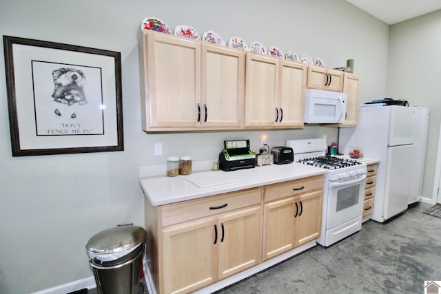 kitchen featuring white appliances, light countertops, baseboards, and light brown cabinetry