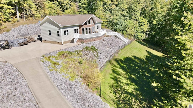 birds eye view of property with a view of trees