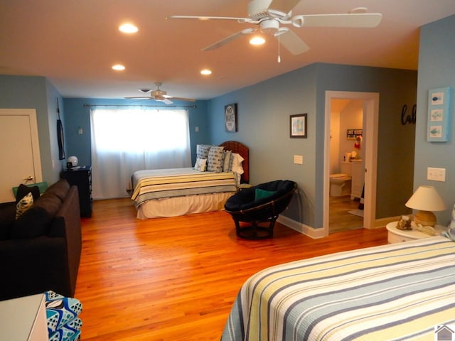 bedroom featuring lofted ceiling, ceiling fan, light wood-style flooring, and recessed lighting