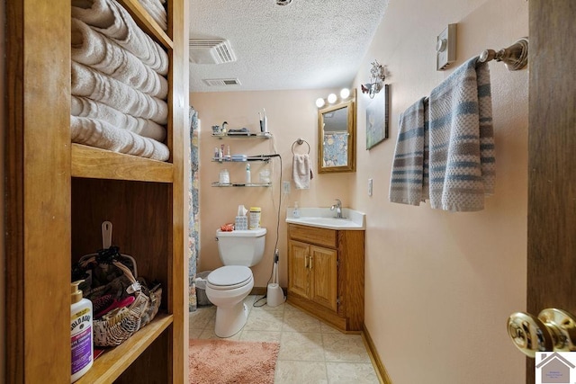 full bathroom with visible vents, toilet, a textured ceiling, vanity, and tile patterned flooring