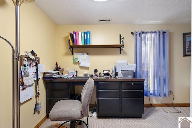 home office with visible vents, light carpet, and baseboards