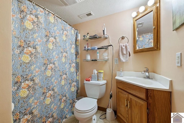 bathroom with visible vents, toilet, a textured ceiling, vanity, and tile patterned flooring