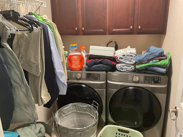 laundry area with cabinet space and washer and dryer