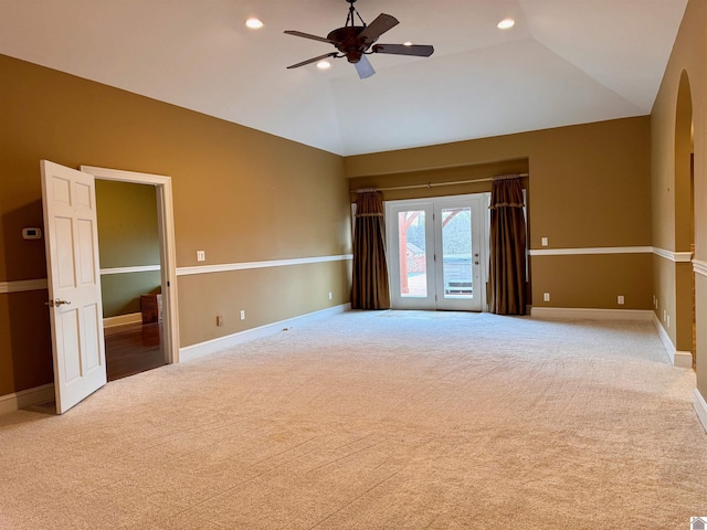 empty room with carpet floors, vaulted ceiling, and recessed lighting