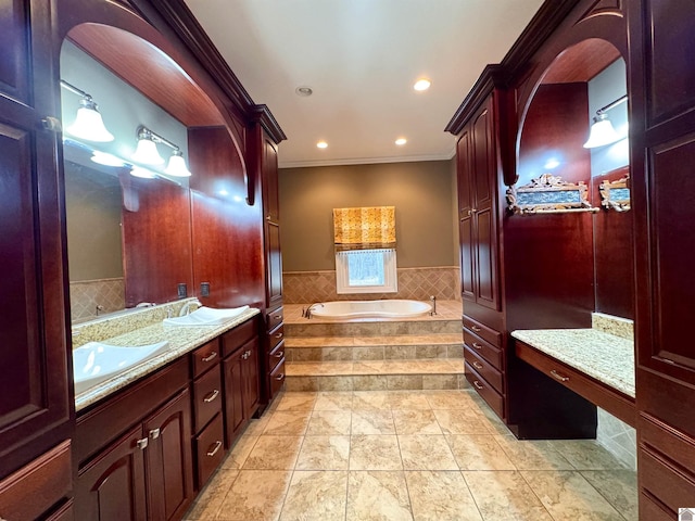 full bath featuring recessed lighting, a sink, ornamental molding, a bath, and double vanity