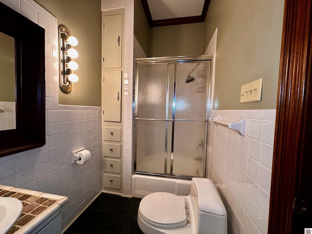 full bath with toilet, vanity, tile patterned flooring, and tile walls