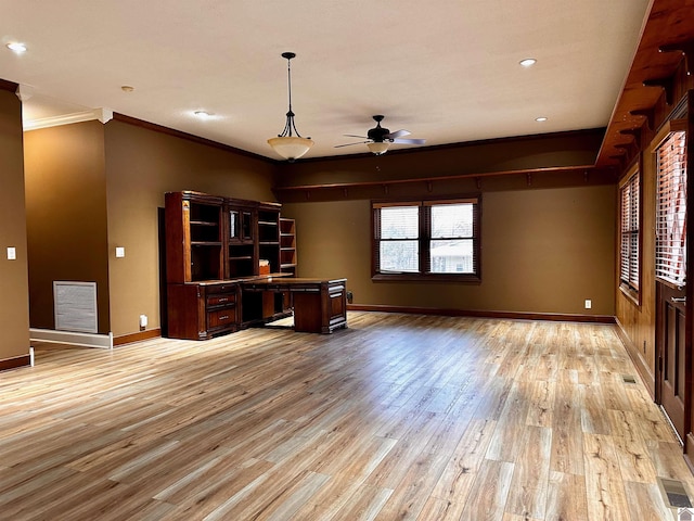 unfurnished office featuring visible vents, crown molding, light wood-style flooring, and baseboards