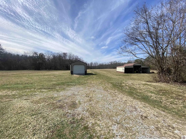 view of yard featuring an outbuilding and an outdoor structure