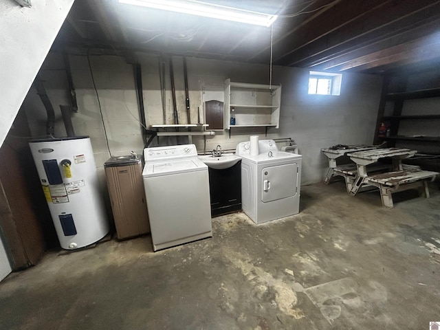 basement with electric water heater and independent washer and dryer